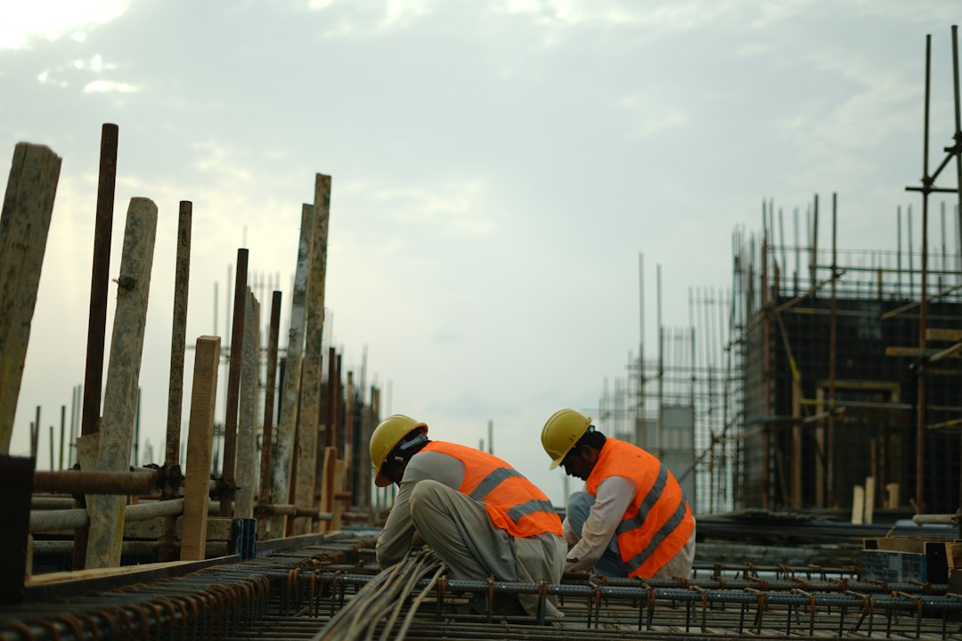 Construction workers in hard hats on a building site